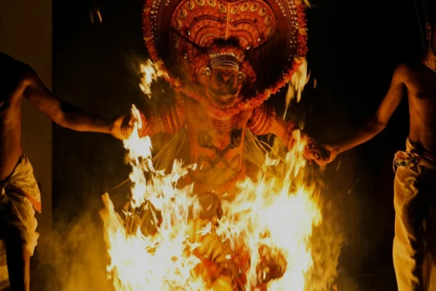 Dhanush Idli Kadai movie poster with actor in intense role, showcasing the journey of this blockbuster Tamil film with Hindi and English text for AajKyaHai.com readers