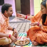 Bhai Dooj 2025 celebration with brother and sister performing tilak ceremony, traditional diya, sweets, and gifts in a festive Indian home setting