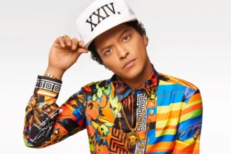 Bruno Mars celebrating birthday with musical instruments, representing his inspiring journey in Hindi and English for AajKyaHai.com readers.