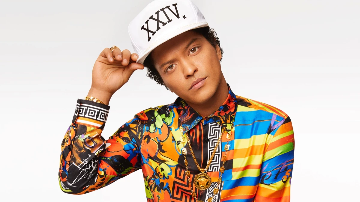 Bruno Mars Birthday: संगीत सफर की प्रेरणा 1 Bruno Mars celebrating birthday with musical instruments, representing his inspiring journey in Hindi and English for AajKyaHai.com readers.