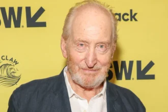 Charles Dance portrait with text overlay in Hindi and English describing his life struggles, featured on AajKyaHai.com news website