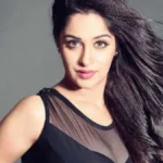 Deepika Kakkar smiling in a festive outfit, celebrating her birthday with family and friends, symbolizing her inspiring life journey from struggles to stardom in Hindi television.