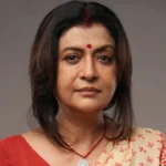 Devashree Roy smiling confidently in a professional photoshoot, symbolizing her journey from struggle to success with Hindi text overlay