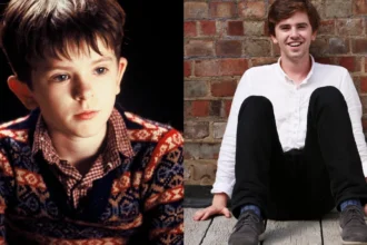 Freddie Highmore smiling in a black suit at an event, with text overlay in Hindi and English highlighting his inspiring journey from child actor to acclaimed star for AajKyaHai.com readers