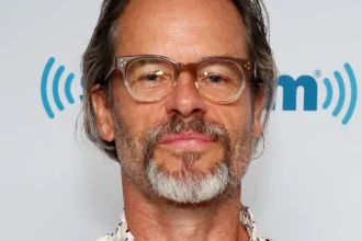 Gay Pierce smiling portrait with inspirational quote in Hindi and English, featured on AajKyaHai.com news website