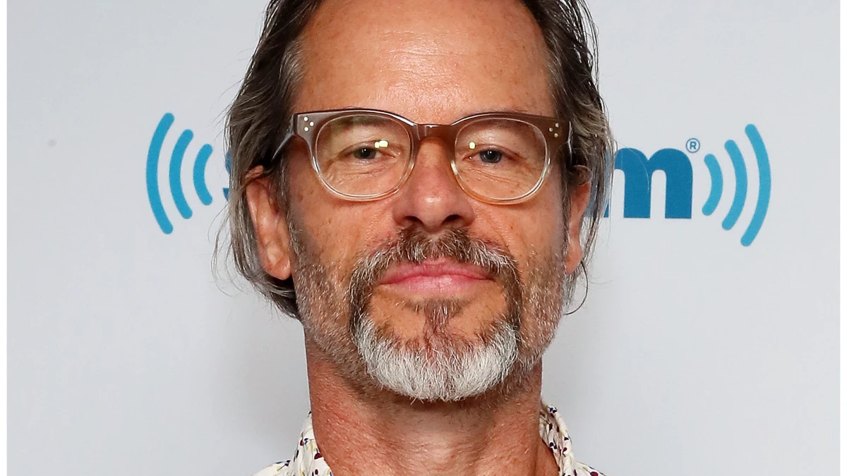 Gay Pierce: जीवन की प्रेरणादायक कहानी 1 Gay Pierce smiling portrait with inspirational quote in Hindi and English, featured on AajKyaHai.com news website