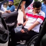 Delhi High Court building exterior with Indian flag, symbolizing the legal decision to end GST exemption on car purchases for disabled persons, with text overlay in Hindi and English.