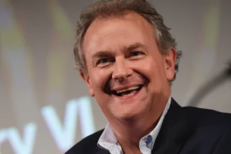 Hugh Bonneville smiling in a suit, from Downton Abbey to Hollywood films, on aajkyahai.com