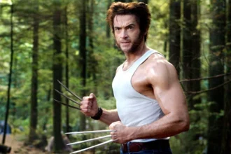 Hugh Jackman smiling in a portrait, with text overlay in Hindi and English about his life journey and inspirational story for fans.