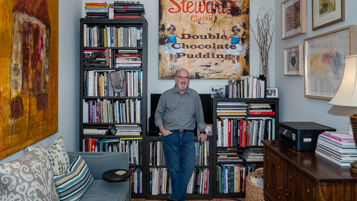 Jerry Siegel, Superman creator, black and white portrait with comic book background, biography details in Hindi and English