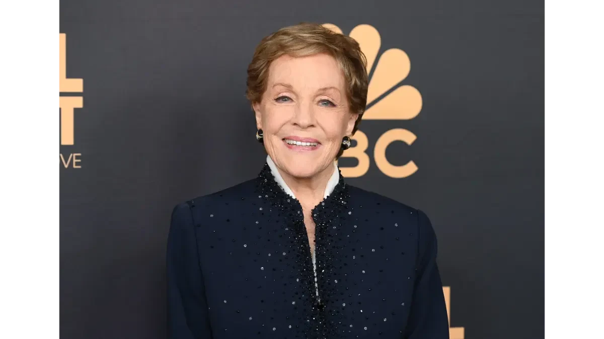 Julie Andrews smiling in a classic pose, with text overlay in Hindi and English highlighting her inspiring life journey from 'Mary Poppins' to iconic roles, set against a vibrant background for AajKyaHai.com readers.