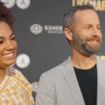 Kirk Cameron smiling in a modern photo, transitioning from his Hollywood days to his current inspirational work, with text overlay in Hindi and English