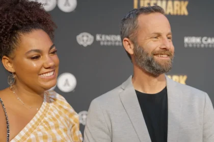 Kirk Cameron smiling in a modern photo, transitioning from his Hollywood days to his current inspirational work, with text overlay in Hindi and English