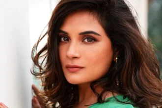 Richa Chadda smiling in a photoshoot, representing her journey from struggle to success in Bollywood, with text overlay in Hindi and English for AajKyaHai.com