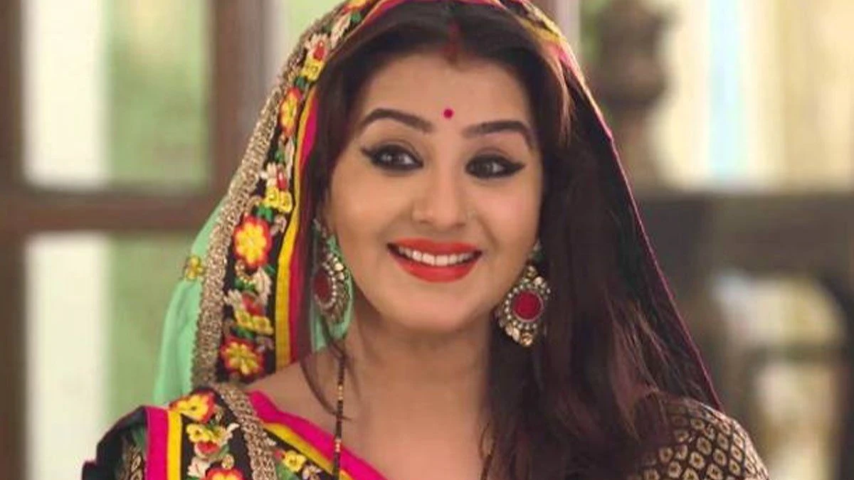 Shilpa Shinde smiling in a photoshoot, wearing traditional Indian attire, representing her journey from Bollywood films to popular TV shows like Bhabiji Ghar Par Hain