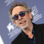 Tim Burton birthday celebration with his iconic characters Edward Scissorhands, Jack Skellington, and Beetlejuice in a dark fantasy style artwork